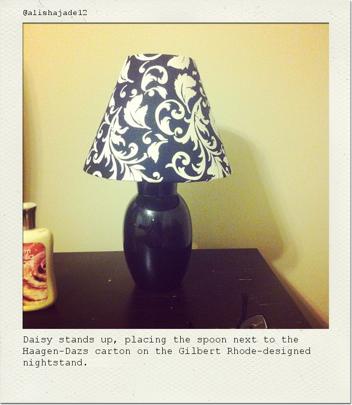 Daisy stands up, placing the spoon next to the Haagen-Dazs carton on the Gilbert Rhode-designed nightstand.