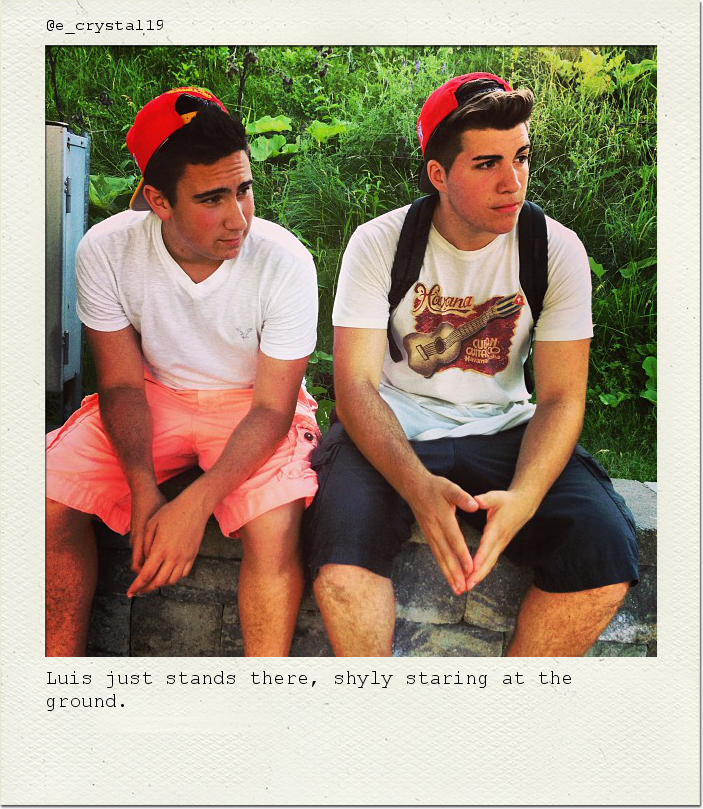 Luis just stands there, shyly staring at the ground.