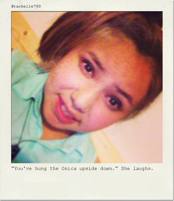 "You've hung the Onica upside down." She laughs.