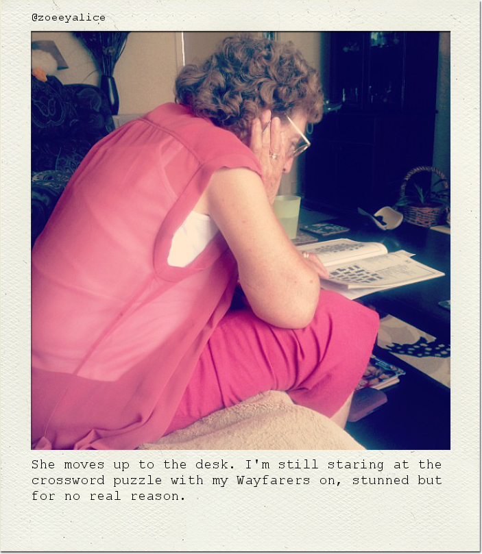 She moves up to the desk. I'm still staring at the crossword puzzle with my Wayfarers on, stunned but for no real reason.