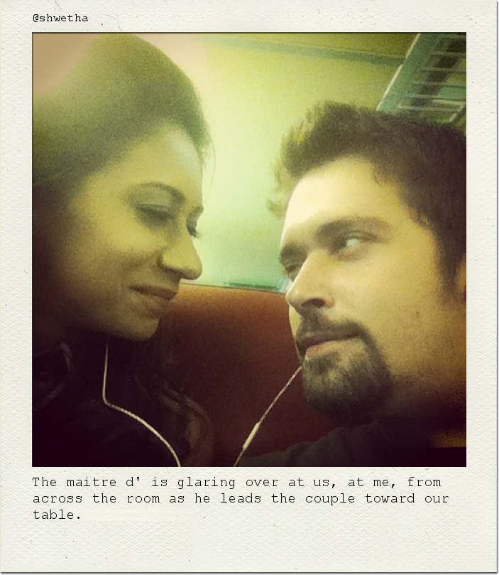 The maitre d' is glaring over at us, at me, from across the room as he leads the couple toward our table.