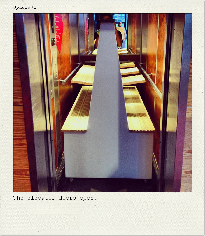 The elevator doors open.